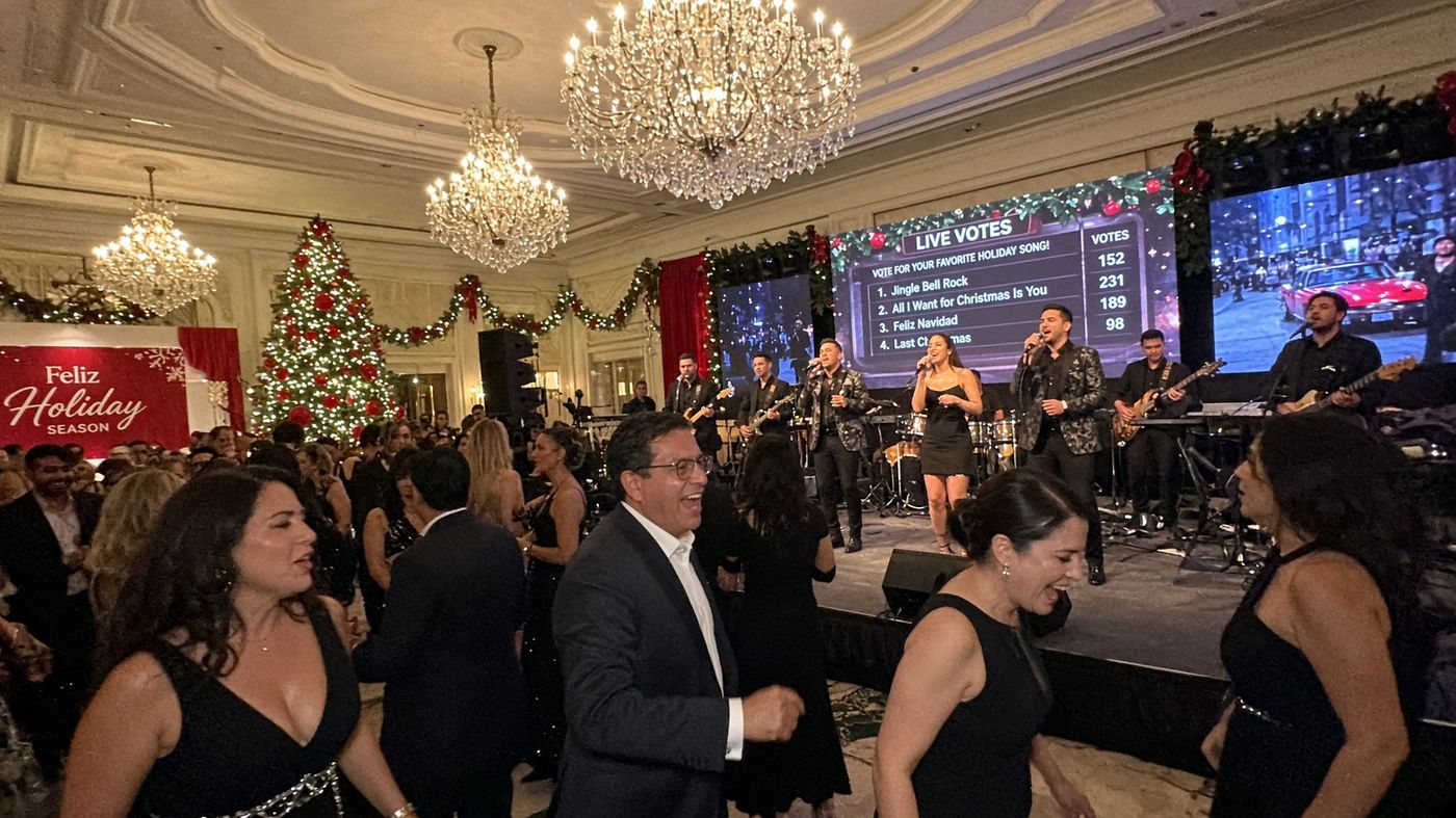 Guests toasting champagne at a holiday gala